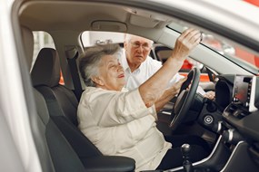 elegant-old-couple-car-salon